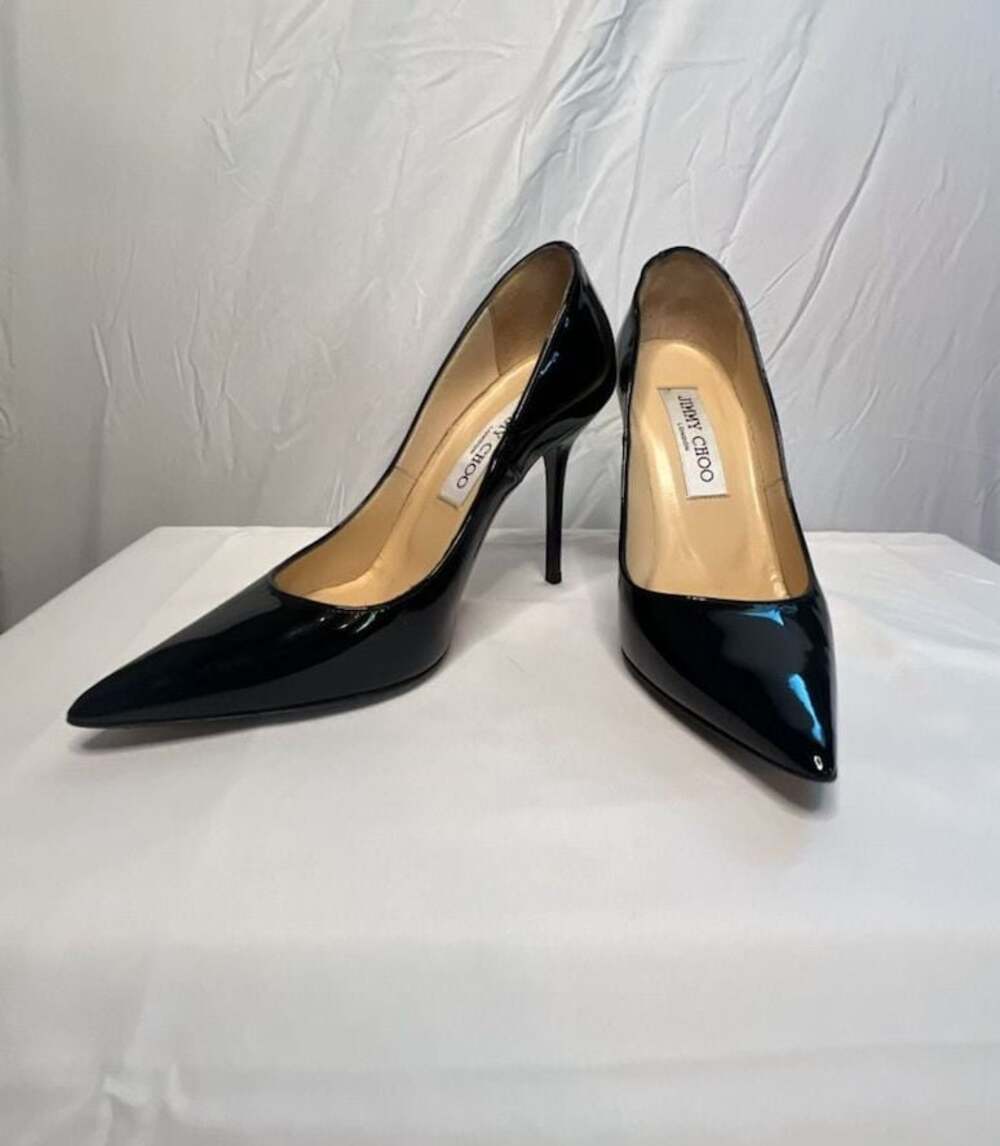 Black Patent Leather Pointed-Toe Pumps with JC Emblem